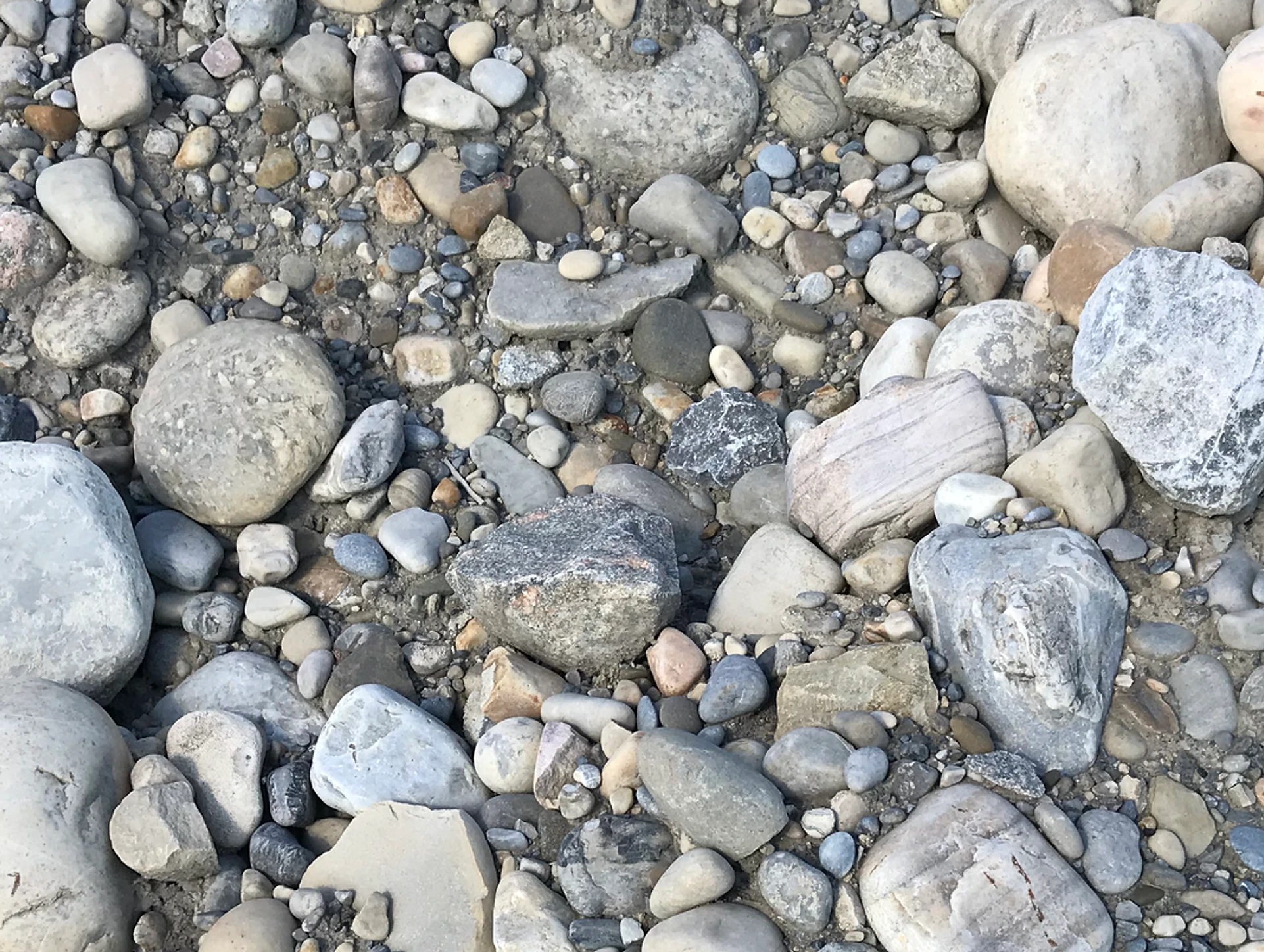 Bank pit run gravel-sand mix stockpile for road sub‑base and fill in Calgary–Edmonton, Alberta