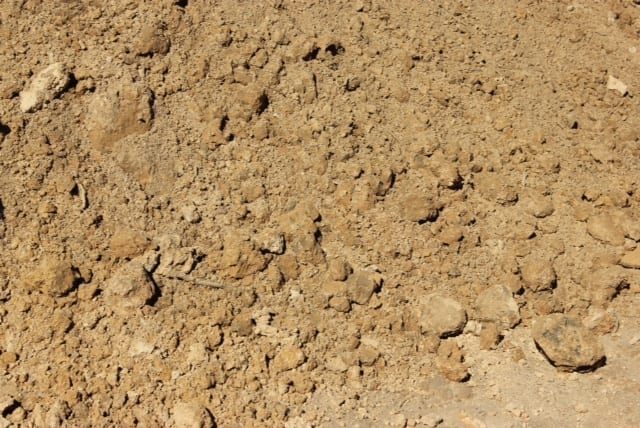 Bulk fill dirt stockpile for backfilling and rough grading in Calgary–Edmonton, Alberta