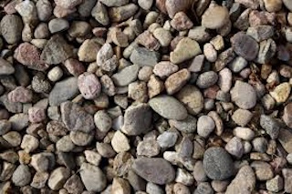 Leachate collection aggregate installed in geomembrane‑lined landfill cell near Calgary–Edmonton, Alberta