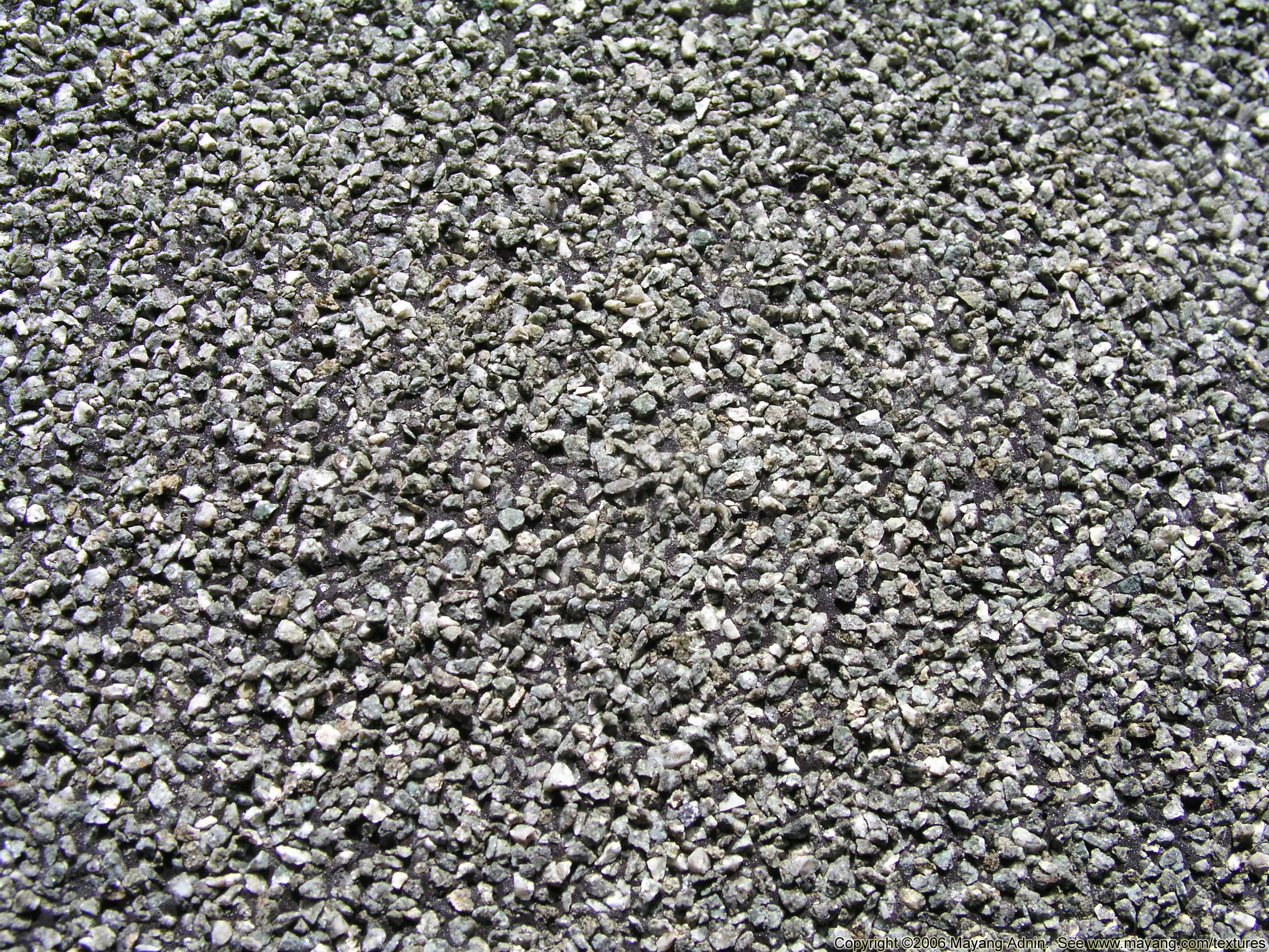Washed roofing gravel (12 mm) used as flood coat ballast on flat roofs in Calgary–Edmonton, Alberta