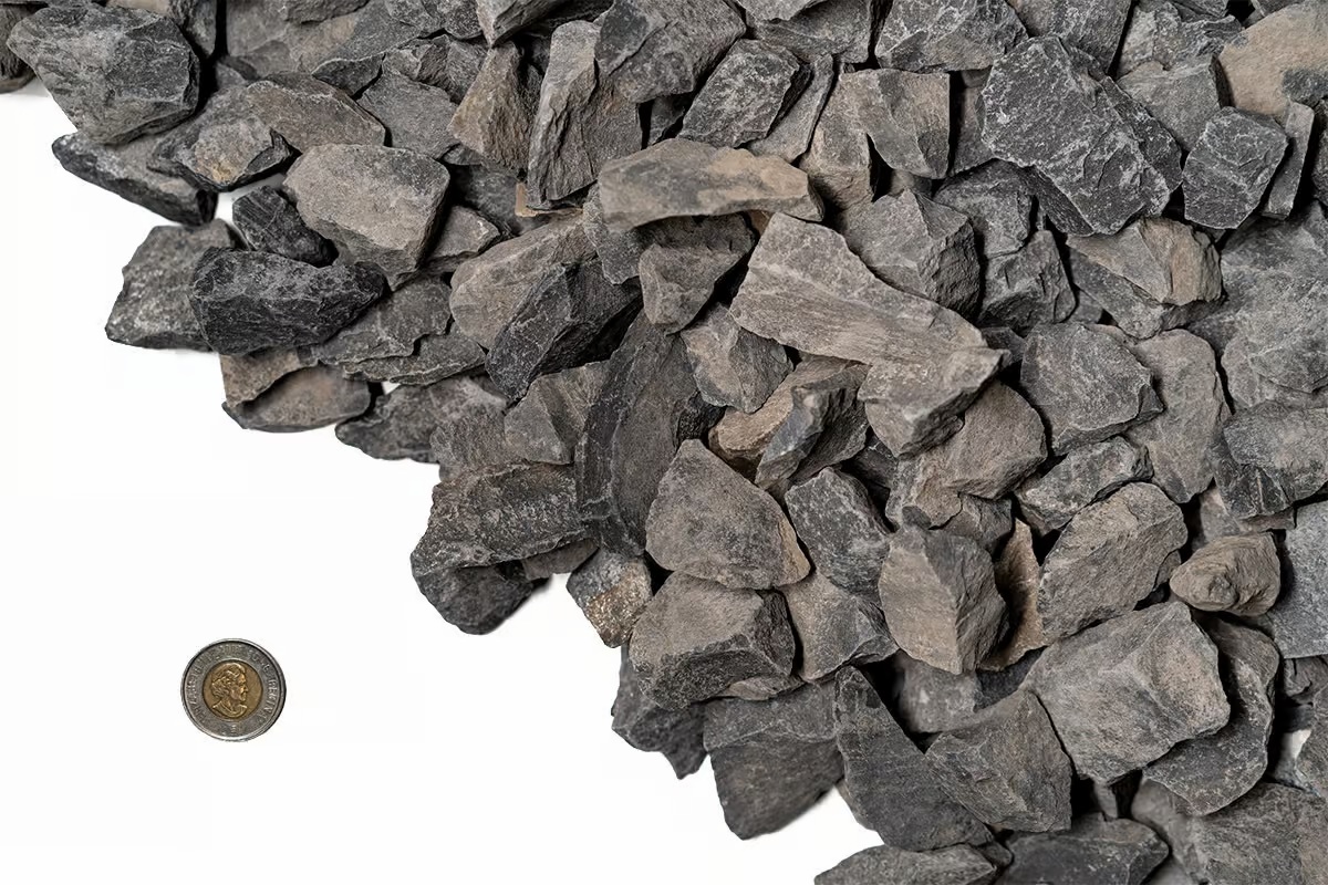 Close-up of 40 mm dark grey Rundle rock used as decorative landscape stone in Alberta (Calgary–Edmonton)