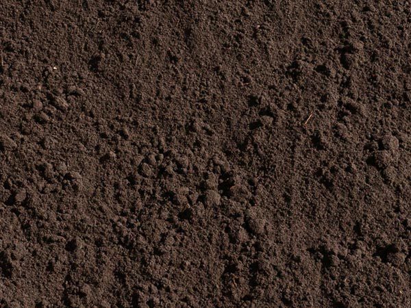 Screened topsoil stockpile for gardens and lawn installation in Calgary–Edmonton, Alberta