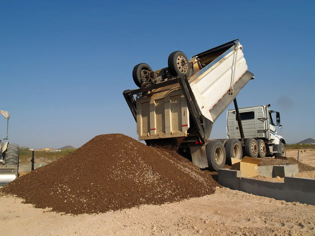 Liquid soil stabilizer being sprayed over subgrade in Calgary–Edmonton, Alberta